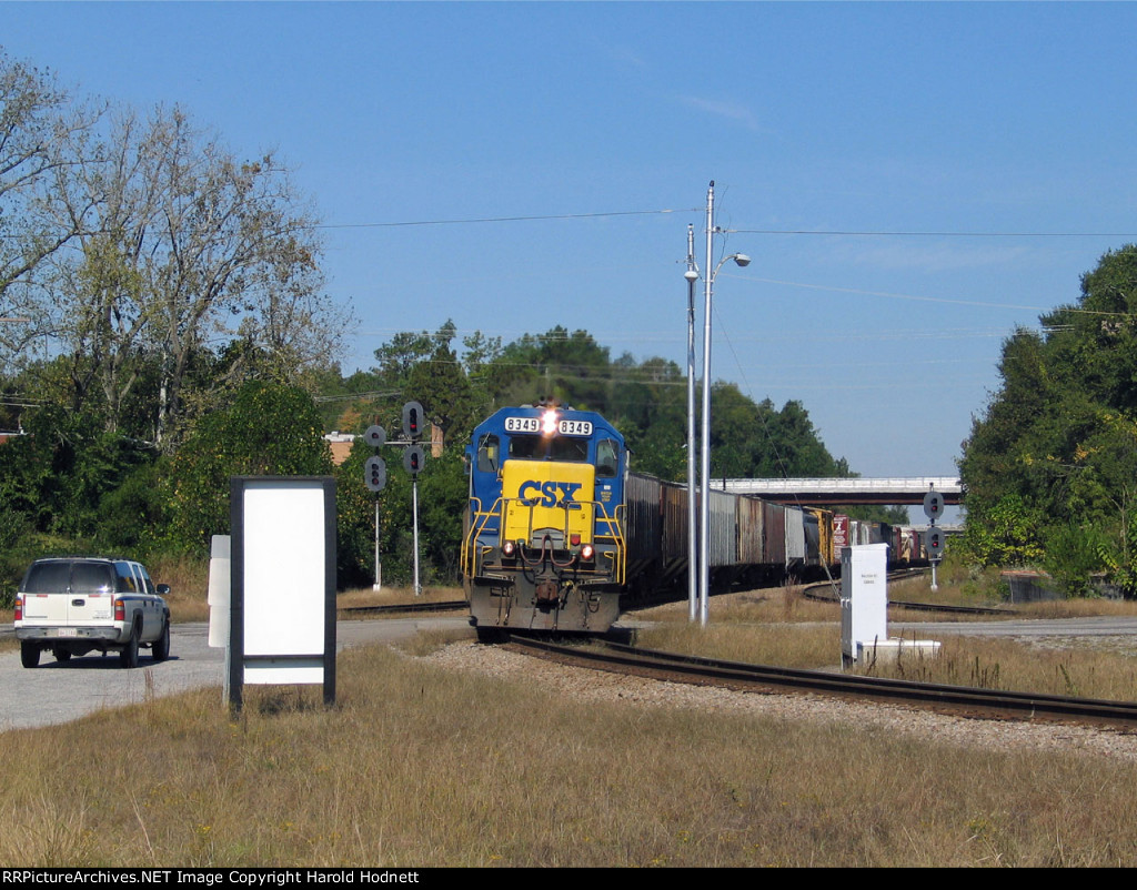 CSX 8349 leads a train across Raleigh Street